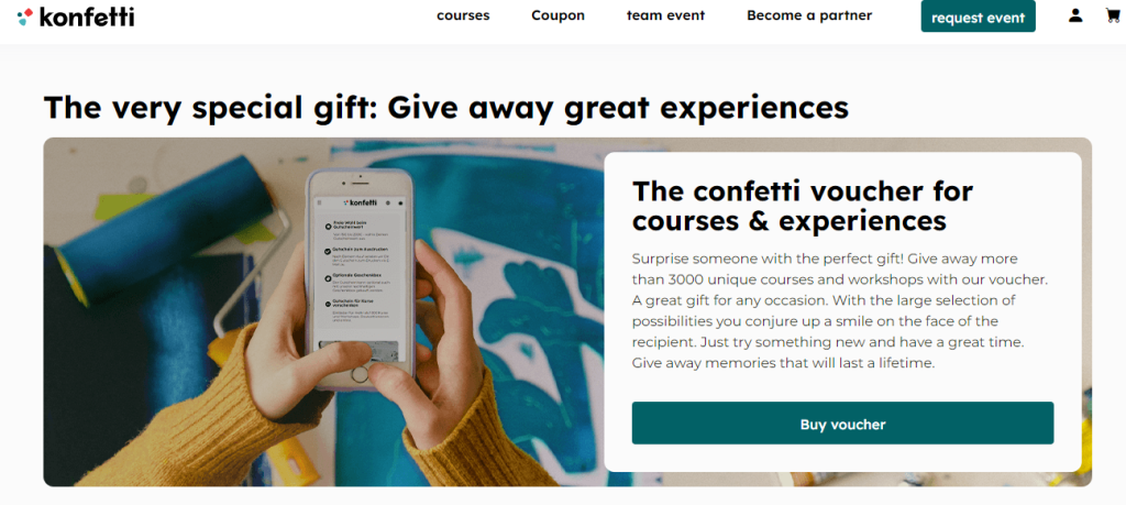 The give away from konfetti and the image with hands holding mobile phone